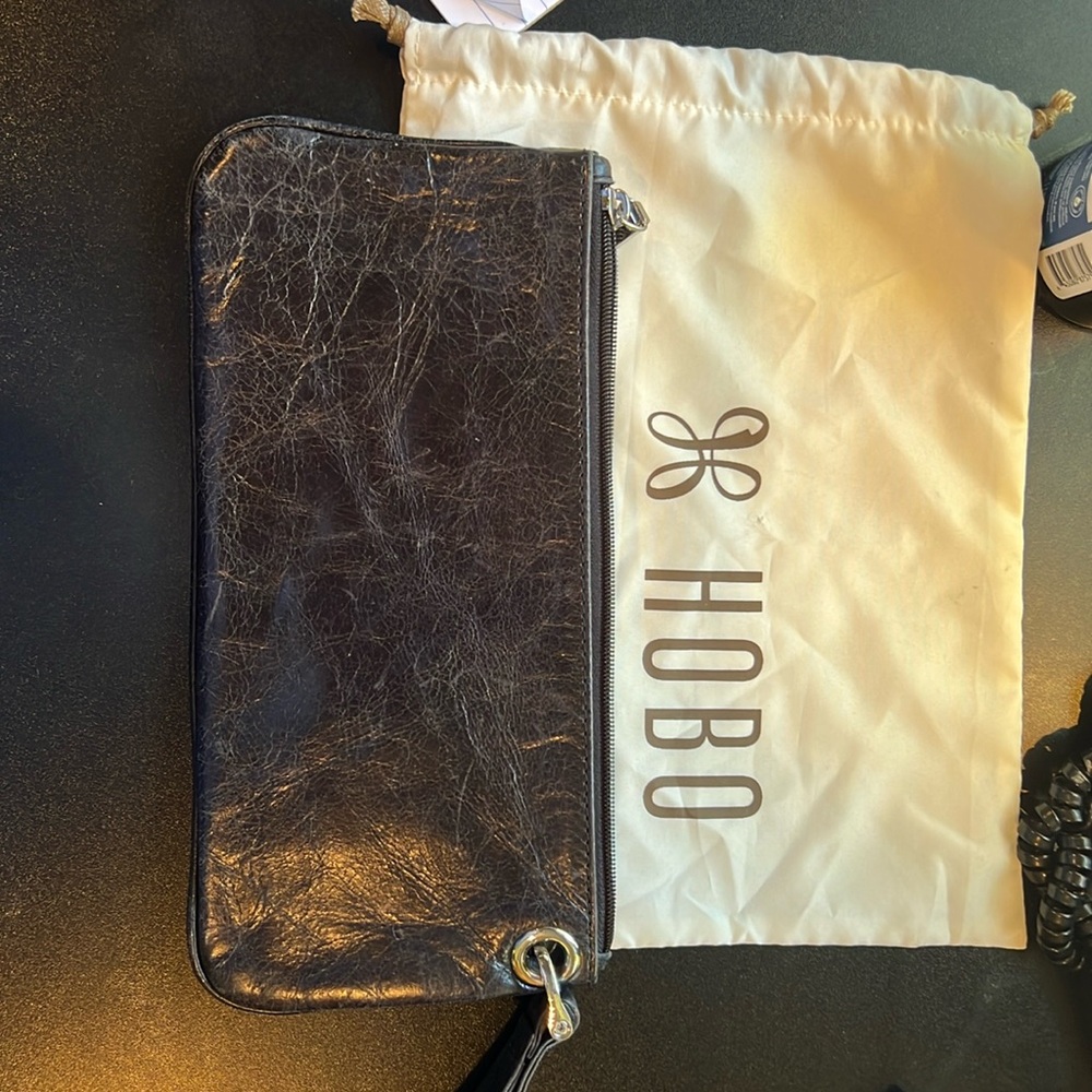 HOBO black women’s clutch with dust cover